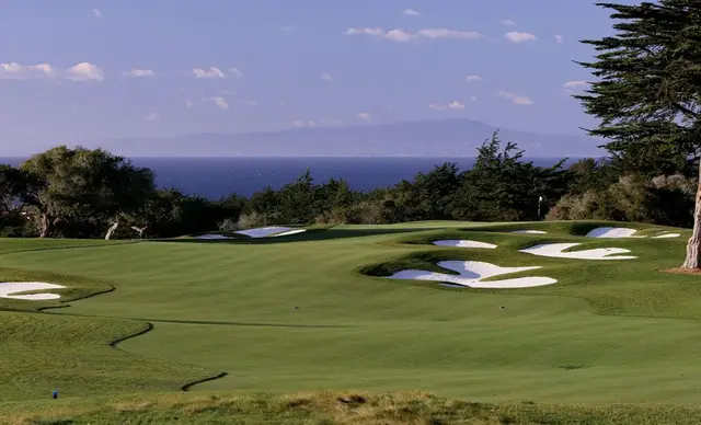 Cypress-framed green at Bayonet with Monterey Bay beyond