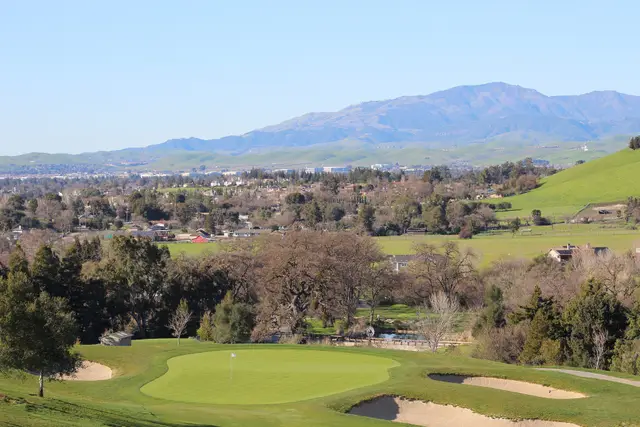 Bunkered green with Mount Diablo in the distance