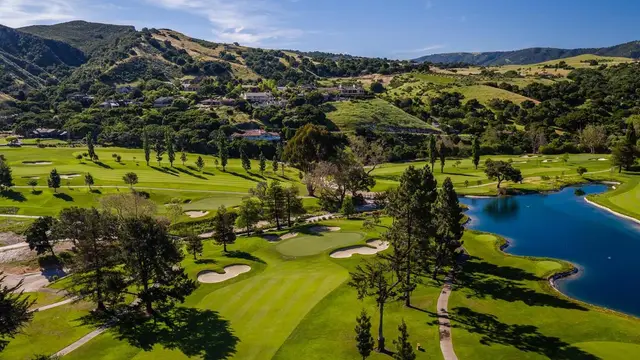 Green beside the lake with the Santa Lucia foothills beyond