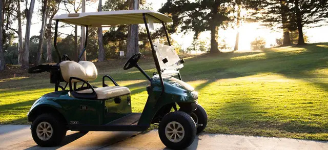 Golf cart in late afternoon light