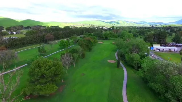 Aerial view over the course toward the hills