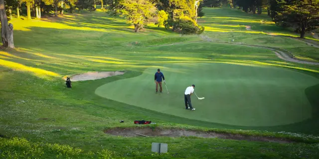 Golfers putting on a green at Gleneagles