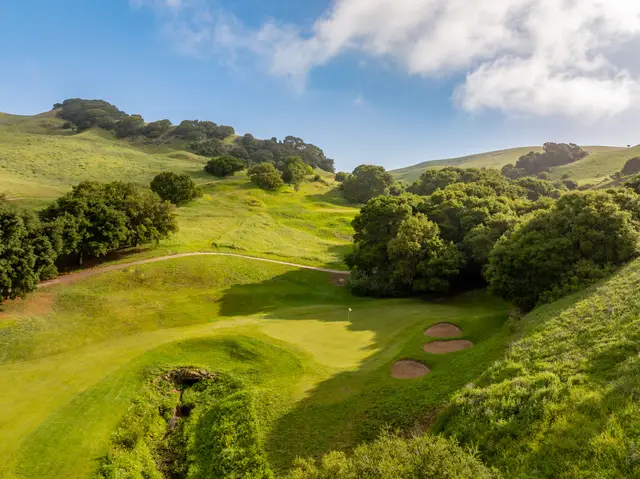 Fairway winding through green hills at Hiddenbrooke
