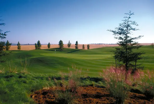 Rolling fairway with Sierra foothills beyond