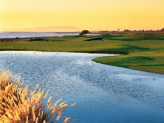 Bayside water hazard at sunset