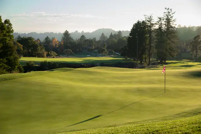 Late-afternoon light over a Pasatiempo green