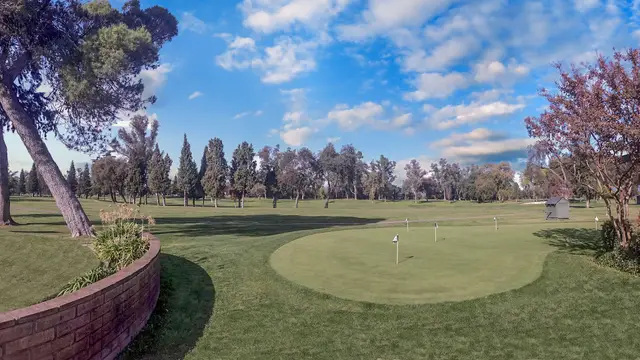Putting green under a blue sky