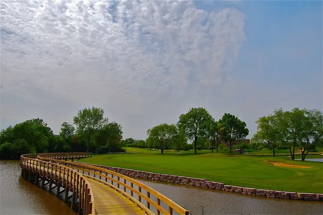 Footbridge across the water at Poplar Creek