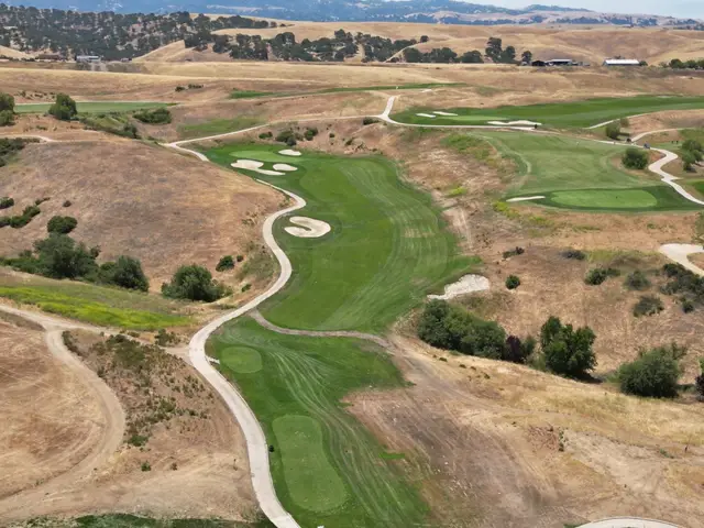 Aerial view of a fairway through the golden hills
