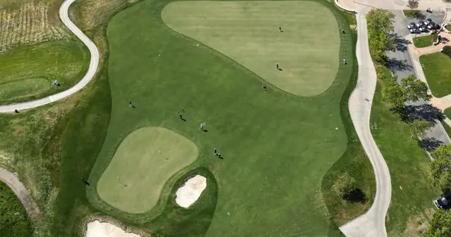 Aerial view of two greens