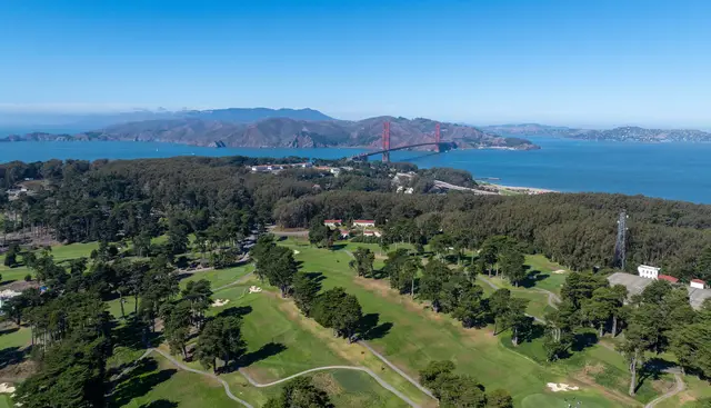 Aerial view of Presidio Golf Course with the Golden Gate Bridge beyond