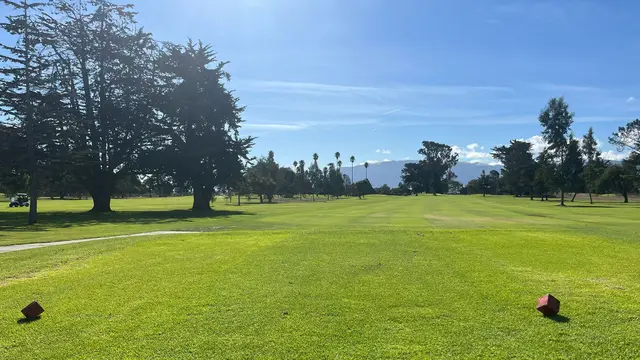 Tee box looking down a wide fairway at Salinas Fairways