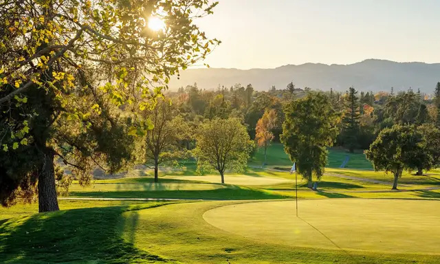 Golden-hour light across a green at Silverado
