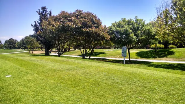 Trees and cart path along a fairway at Sunnyvale