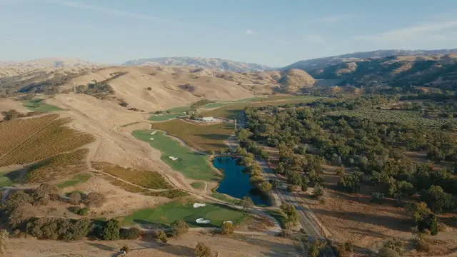 Aerial view of the course in its valley