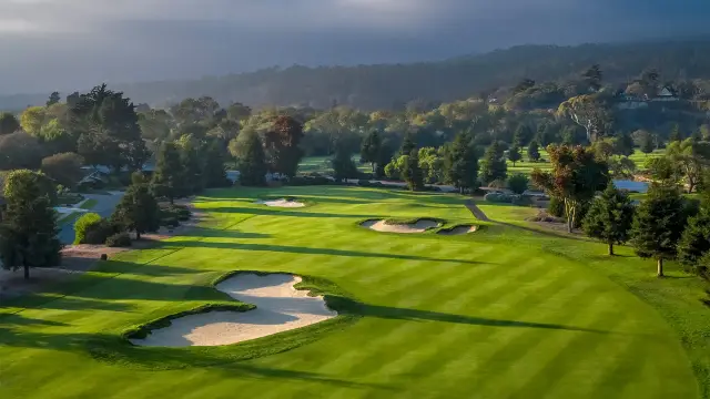 Striped fairway and bunkers in morning light