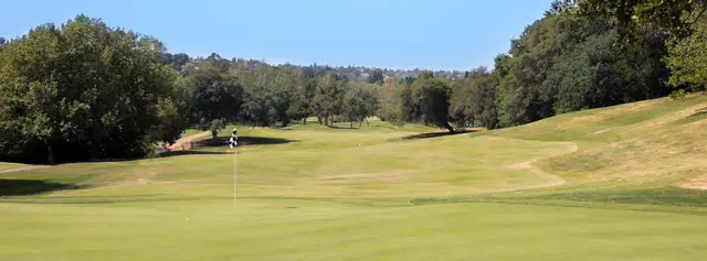Green framed by oaks at Whitney Oaks