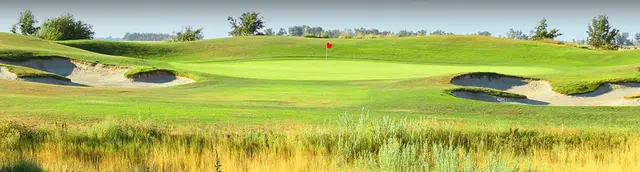 Bunkered green beyond native grasses at Wildhorse